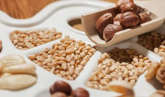 depositphotos_336501552-stock-photo-various-nuts-almonds-grain-grains